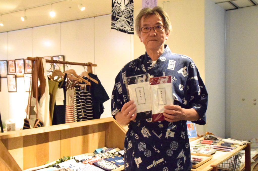 Tanaka, a staff member of the Tokyo Tenugui Hompo, shown at aona shop. 